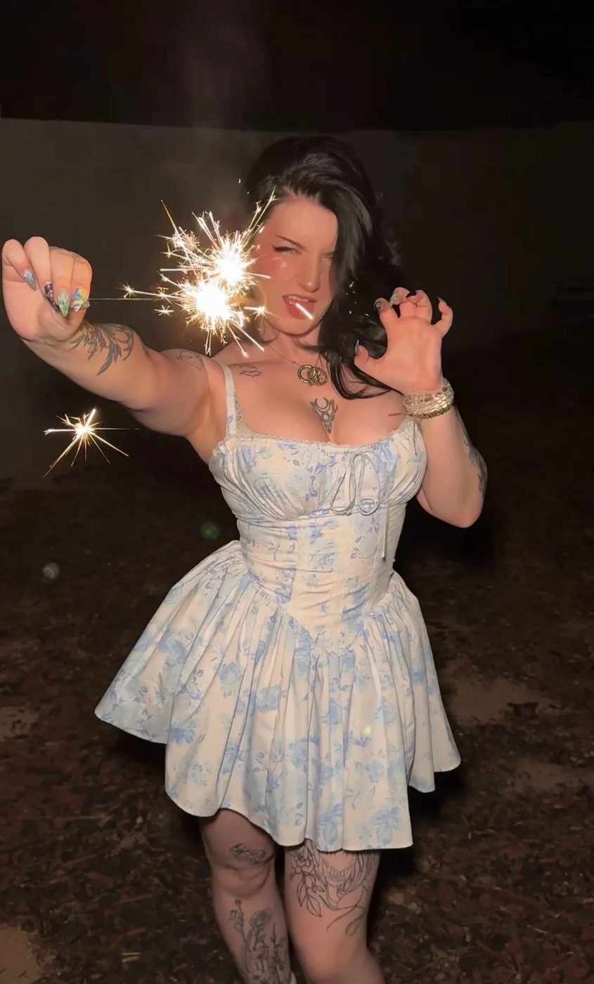 Brianna holding sparklers at night